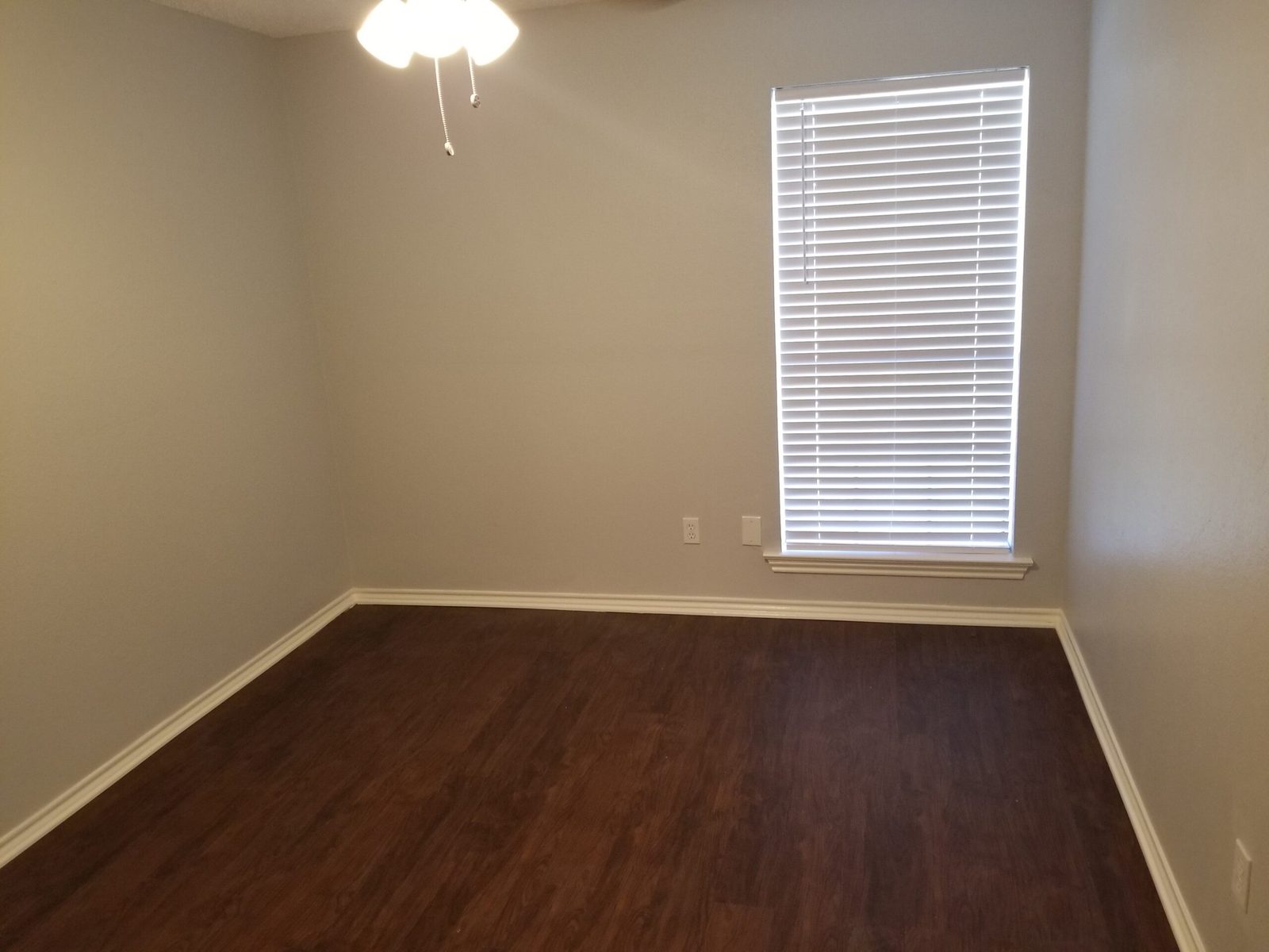 Bedroom two with ceiling fan and window with blinds