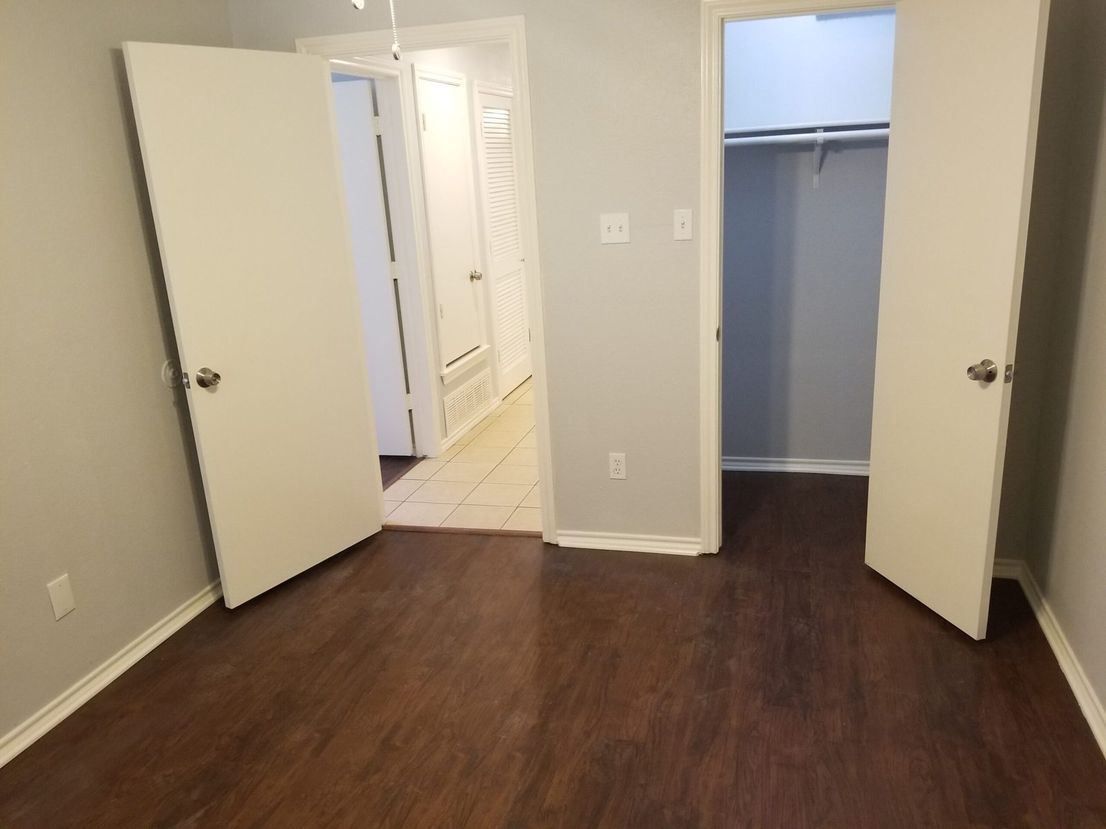 Walk-in closet and hallway access from bedroom two