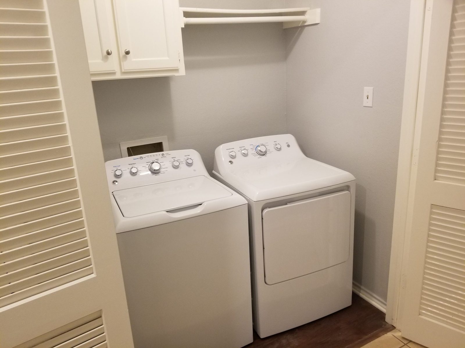 In-unit laundry closet with the full size washer and dryer that are included