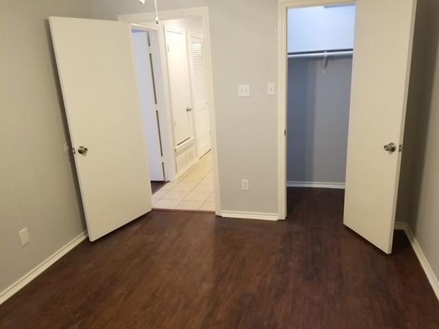 LIGHTED WALK-IN CLOSET IN BEDROOM 2